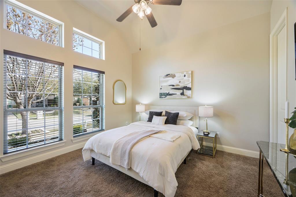 1220 Packsaddle Trail Prosper, TX 75078 - Photo 20 of 33 a bedroom with a large bed and a large window