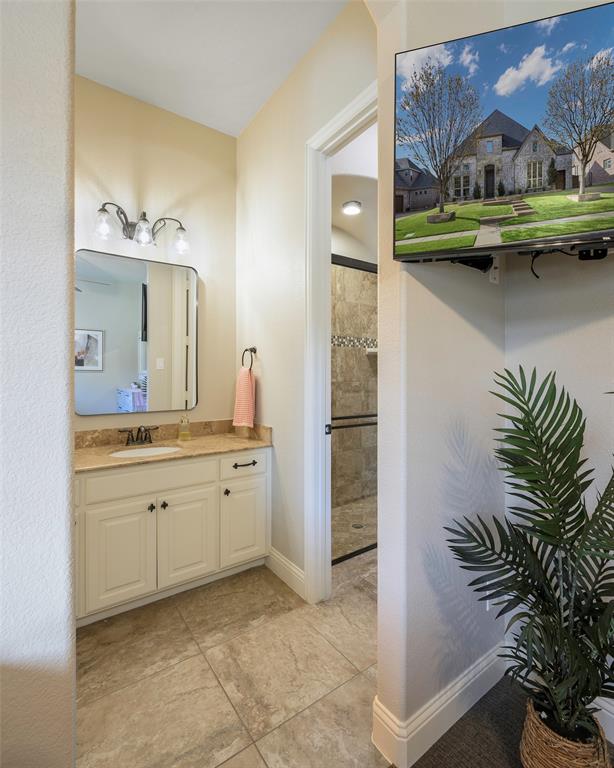 1220 Packsaddle Trail Prosper, TX 75078 - Photo 23 of 33 a bathroom with a sink and a mirror