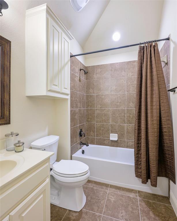 1220 Packsaddle Trail Prosper, TX 75078 - Photo 29 of 33 a bathroom with a sink a toilet and a bathtub