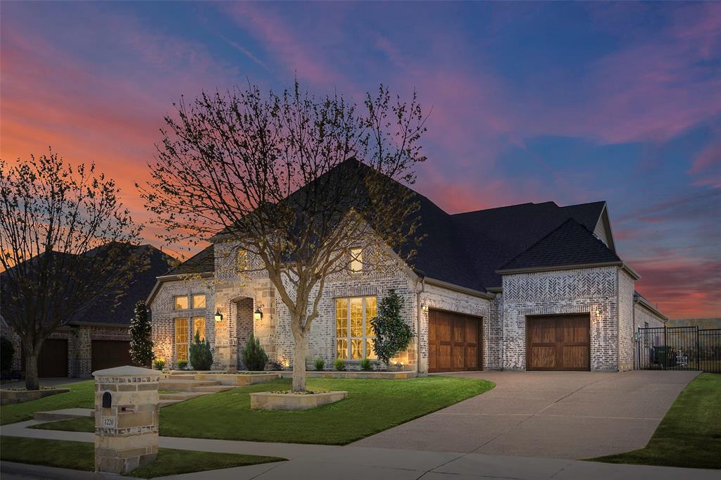 1220 Packsaddle Trail Prosper, TX 75078 - Photo 31 of 33 a front view of a house with a garden