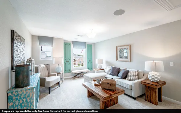 a living room with furniture and a lamp