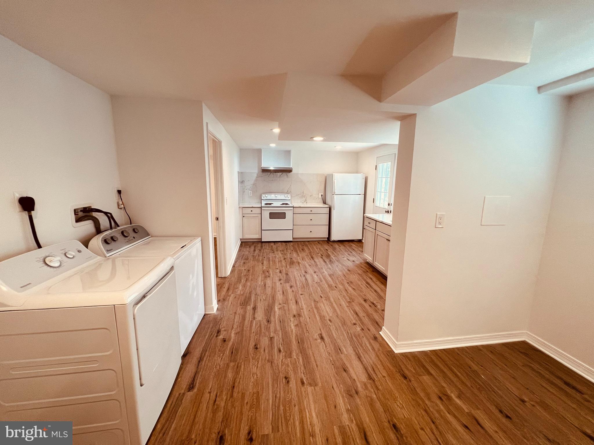11814 Mentone Road Silver Spring, MD 20906 - Photo 4 of 12 a view of a kitchen with sink and wooden floor