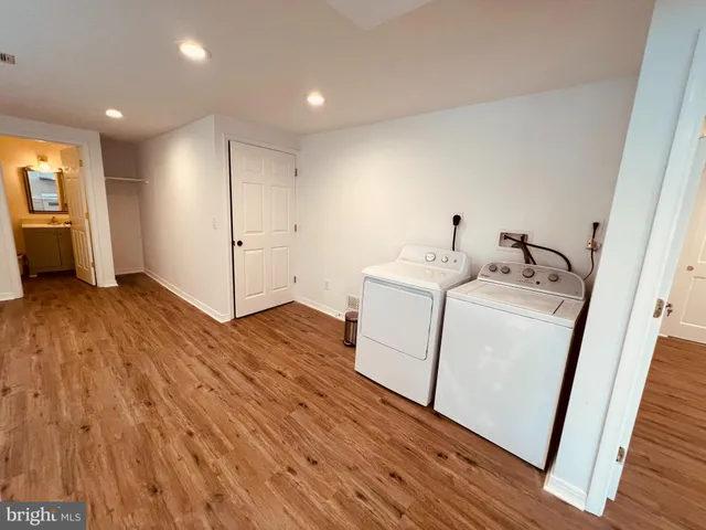 a view of a storage & utility room with washer and dryer