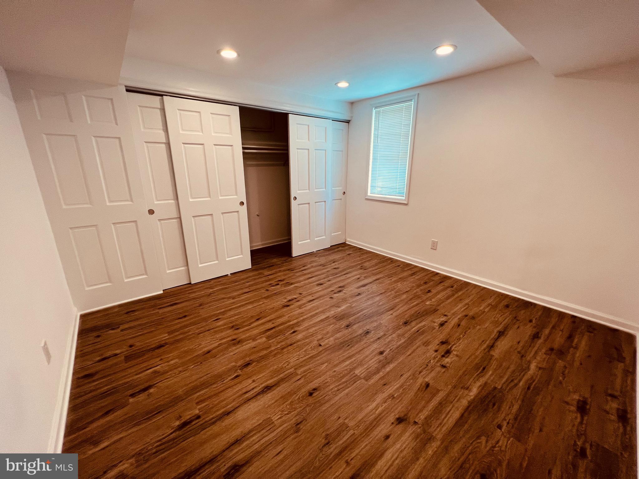 11814 Mentone Road Silver Spring, MD 20906 - Photo 9 of 12 a view of an empty room with wooden floor