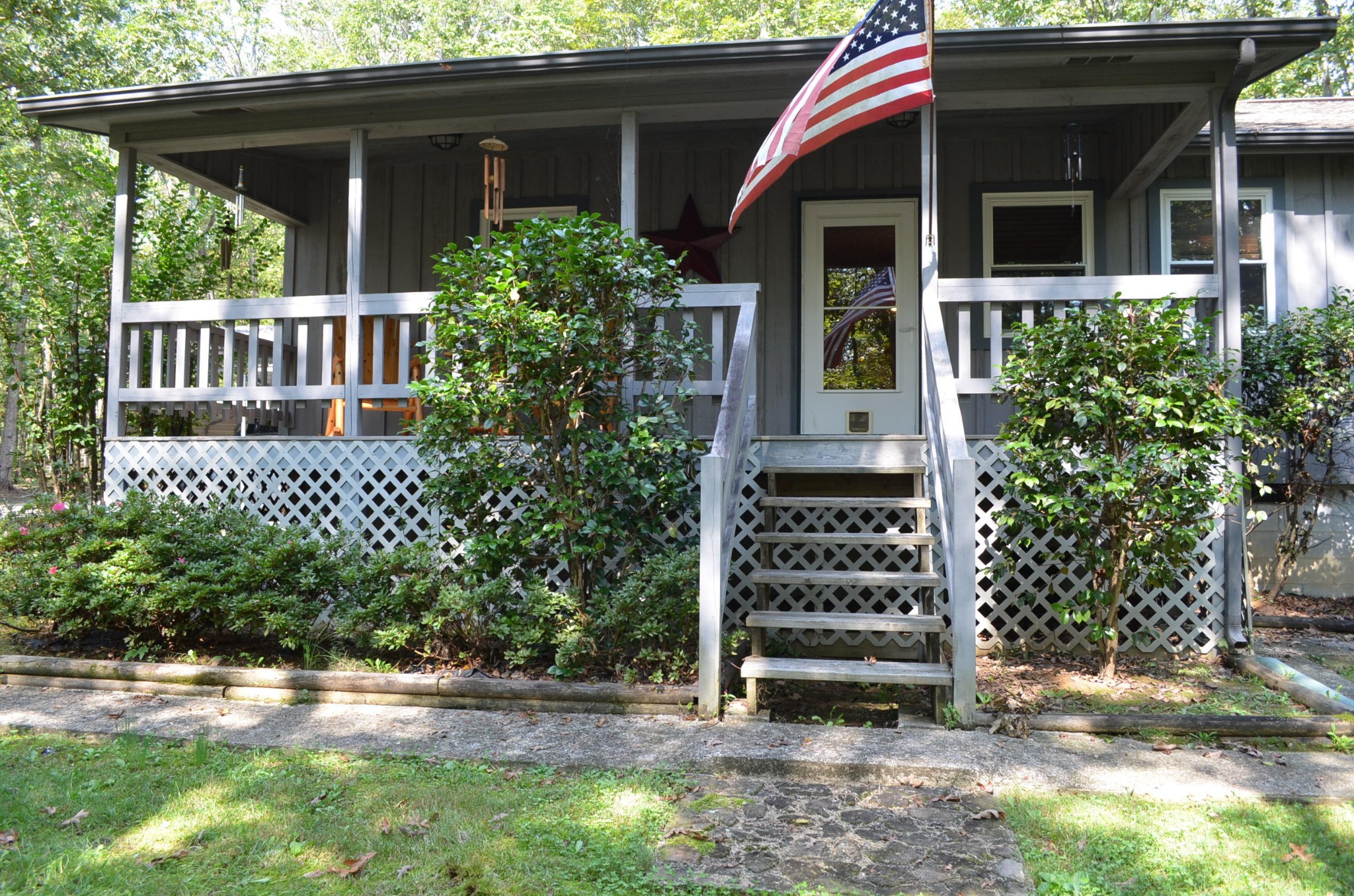 175 Memory Lane Grandview, TN 37337 - Photo 3 of 23 a front view of a house with a garden