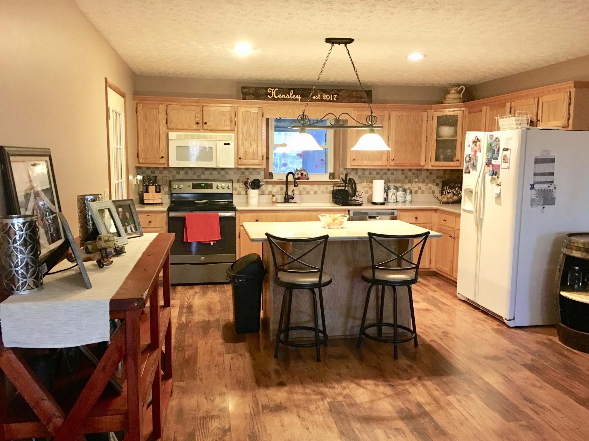 175 Memory Lane Grandview, TN 37337 - Photo 7 of 23 a dining room with stainless steel appliances a table chairs and a refrigerator