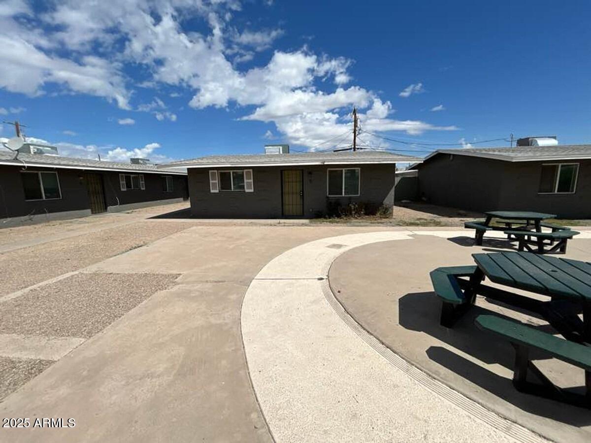 a view of a swimming pool with furniture