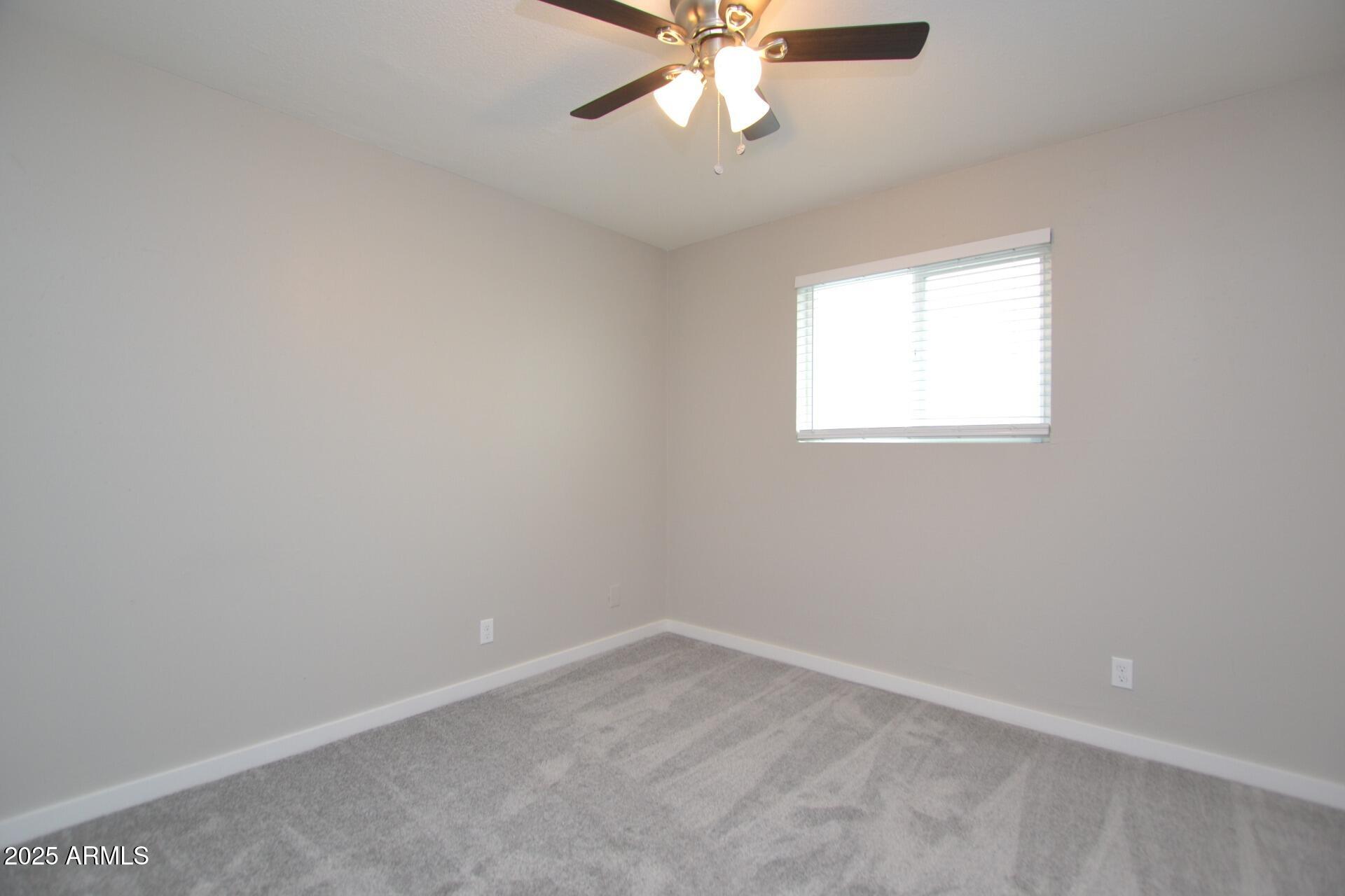 2202 West Devonshire Avenue, Unit 3 Phoenix, AZ 85015 - Photo 11 of 16 an empty room with a window