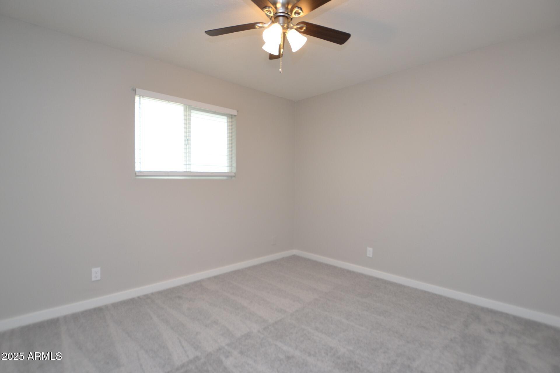 2202 West Devonshire Avenue, Unit 3 Phoenix, AZ 85015 - Photo 13 of 16 an empty room with a window