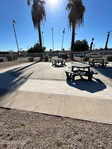 a view of swimming pool with outdoor seating
