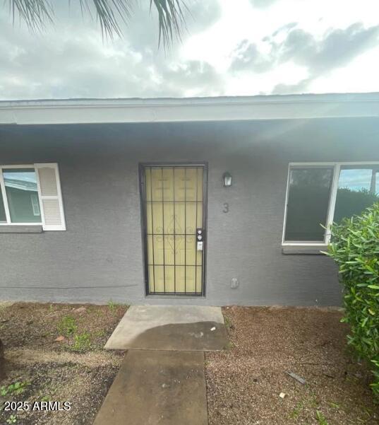 2202 West Devonshire Avenue, Unit 3 Phoenix, AZ 85015 - Photo 3 of 16 a view of a livingroom with window and outdoor space