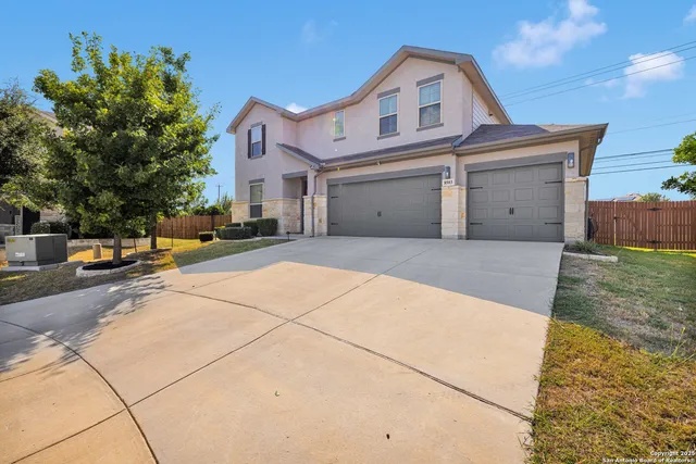 a view of a white apartments with large windows