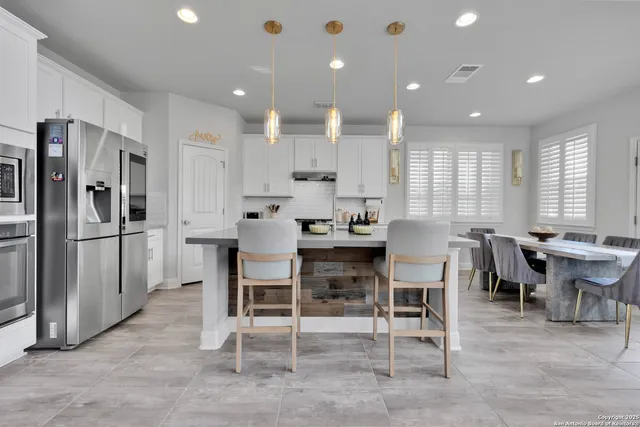a kitchen with a stove and cabinets