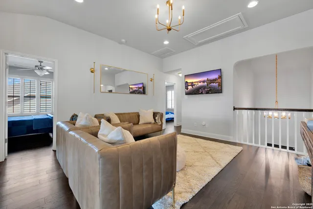 a bathroom with a bathtub shower sink and mirror