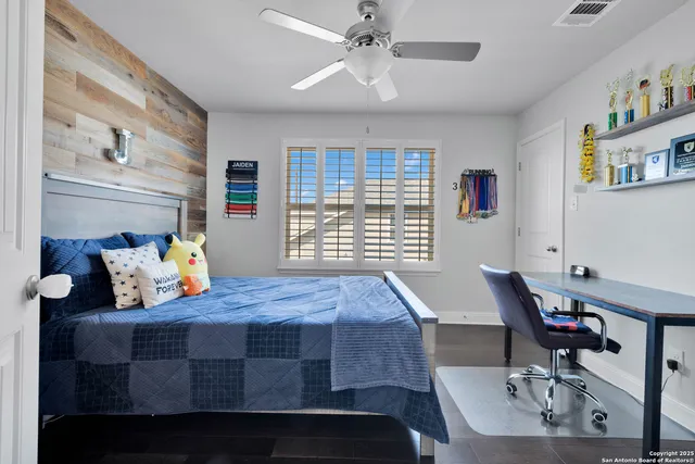 a bedroom with a bed and a window