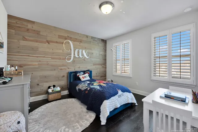 a view of a porch with table and chairs and potted plants