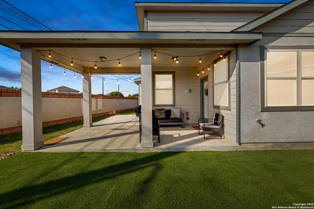 a view of a swimming pool with an outdoor seating