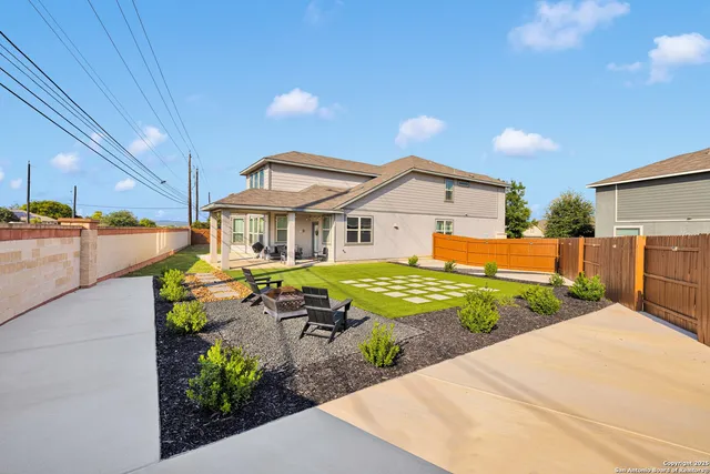 a aerial view of a house with swimming pool and sitting space