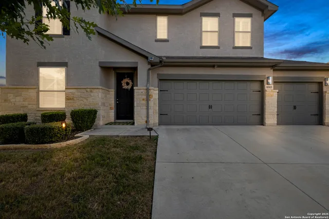 an aerial view of residential houses with outdoor space