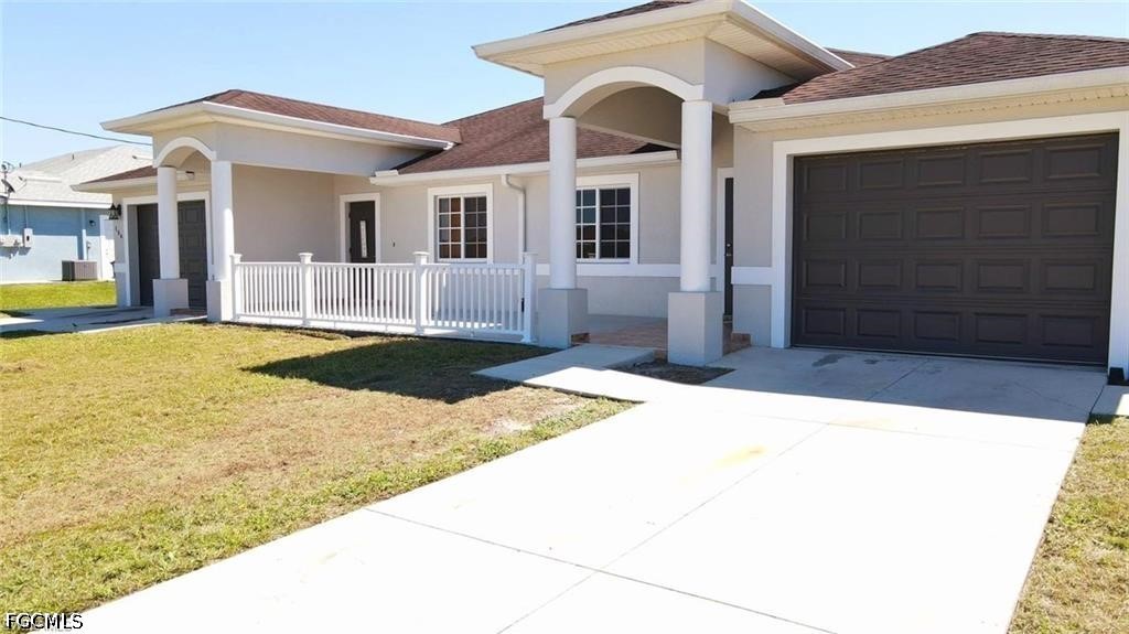 152 Pullman Street Lehigh Acres, FL 33974 - Photo 2 of 15 a view of a house with a swimming pool