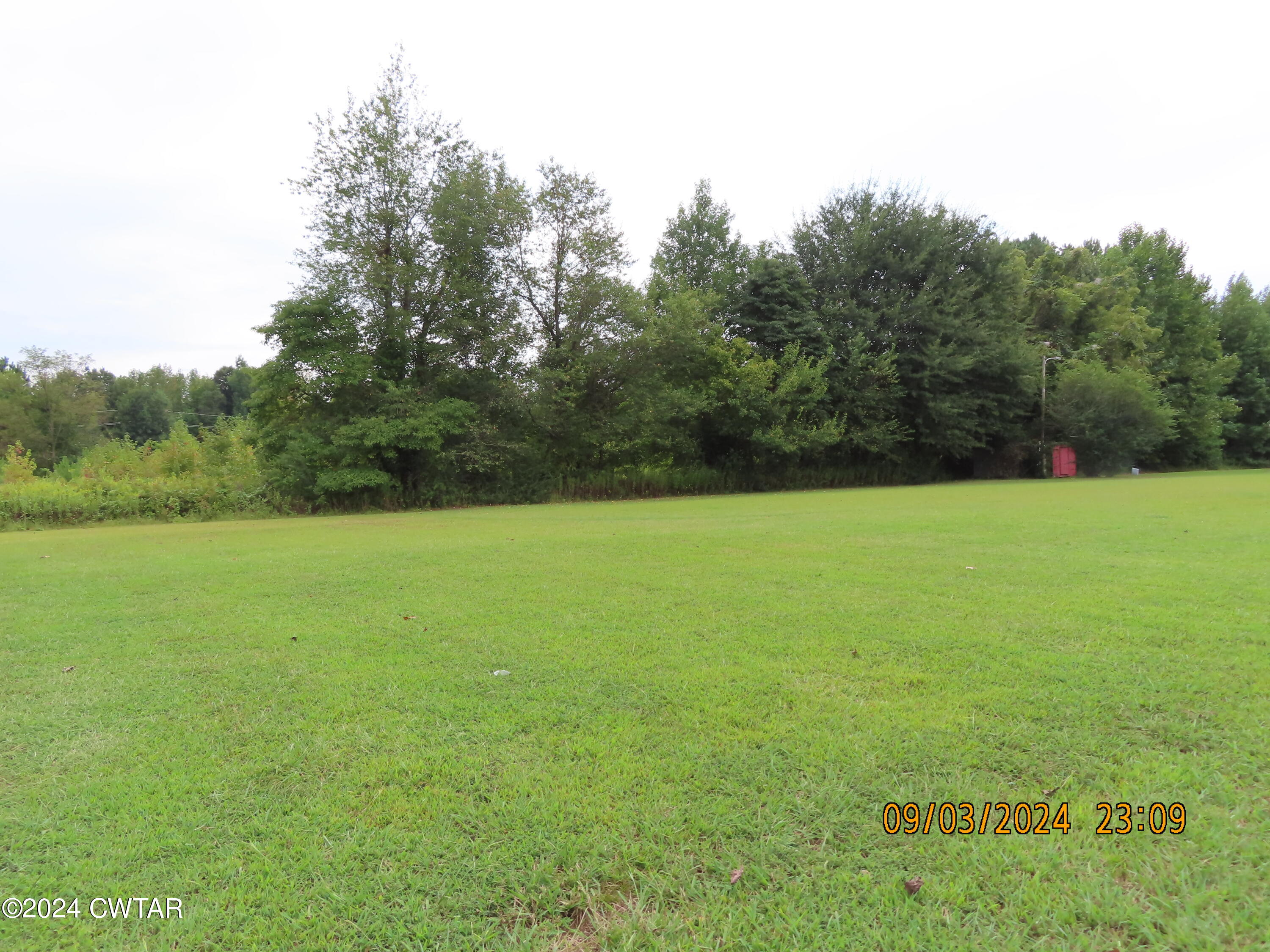 254 Rhea Street Jackson, TN 38301 - Photo 12 of 21 a view of a field with a trees in the background