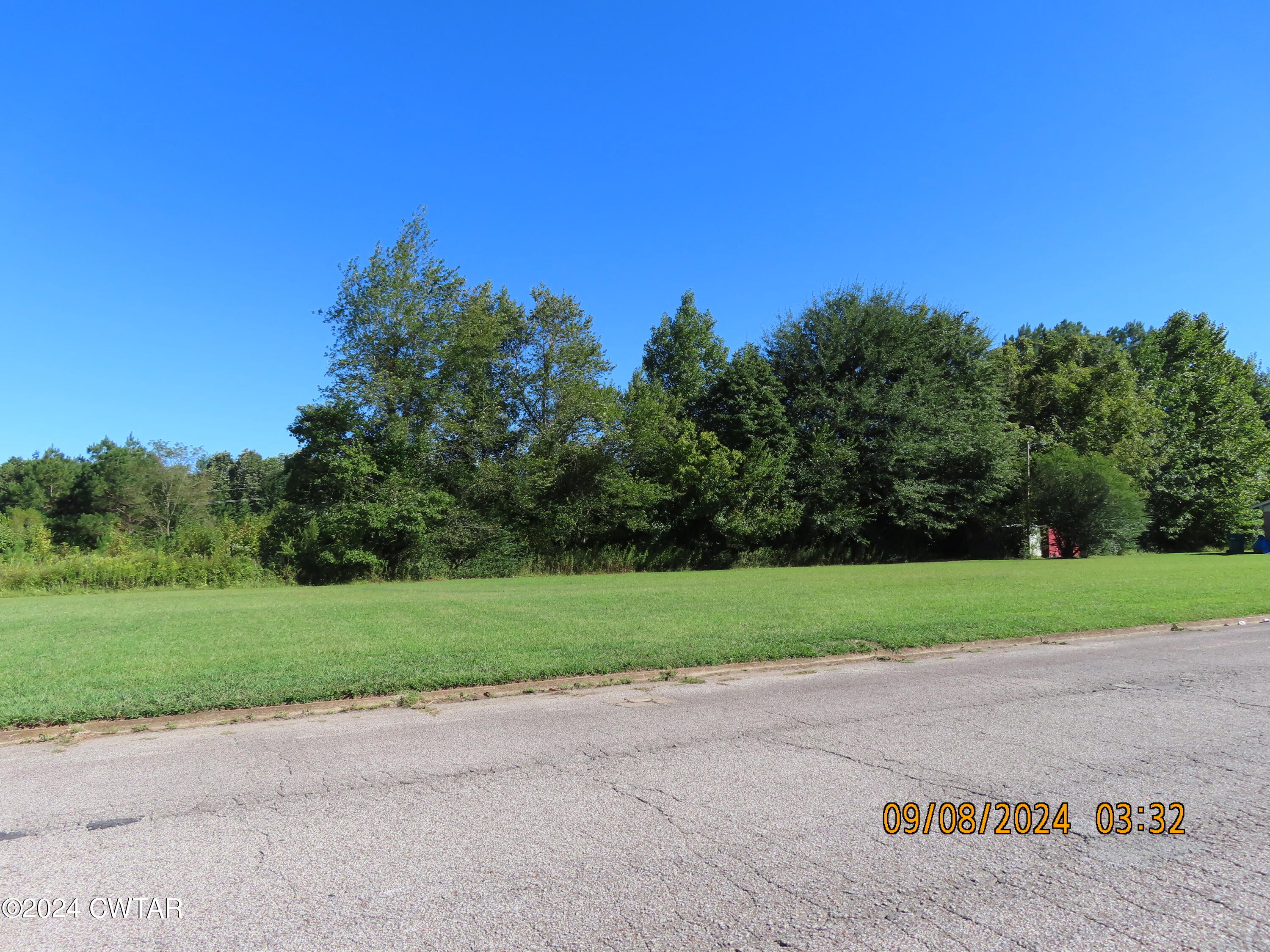 254 Rhea Street Jackson, TN 38301 - Photo 2 of 21 a view of a field with a tree in the background