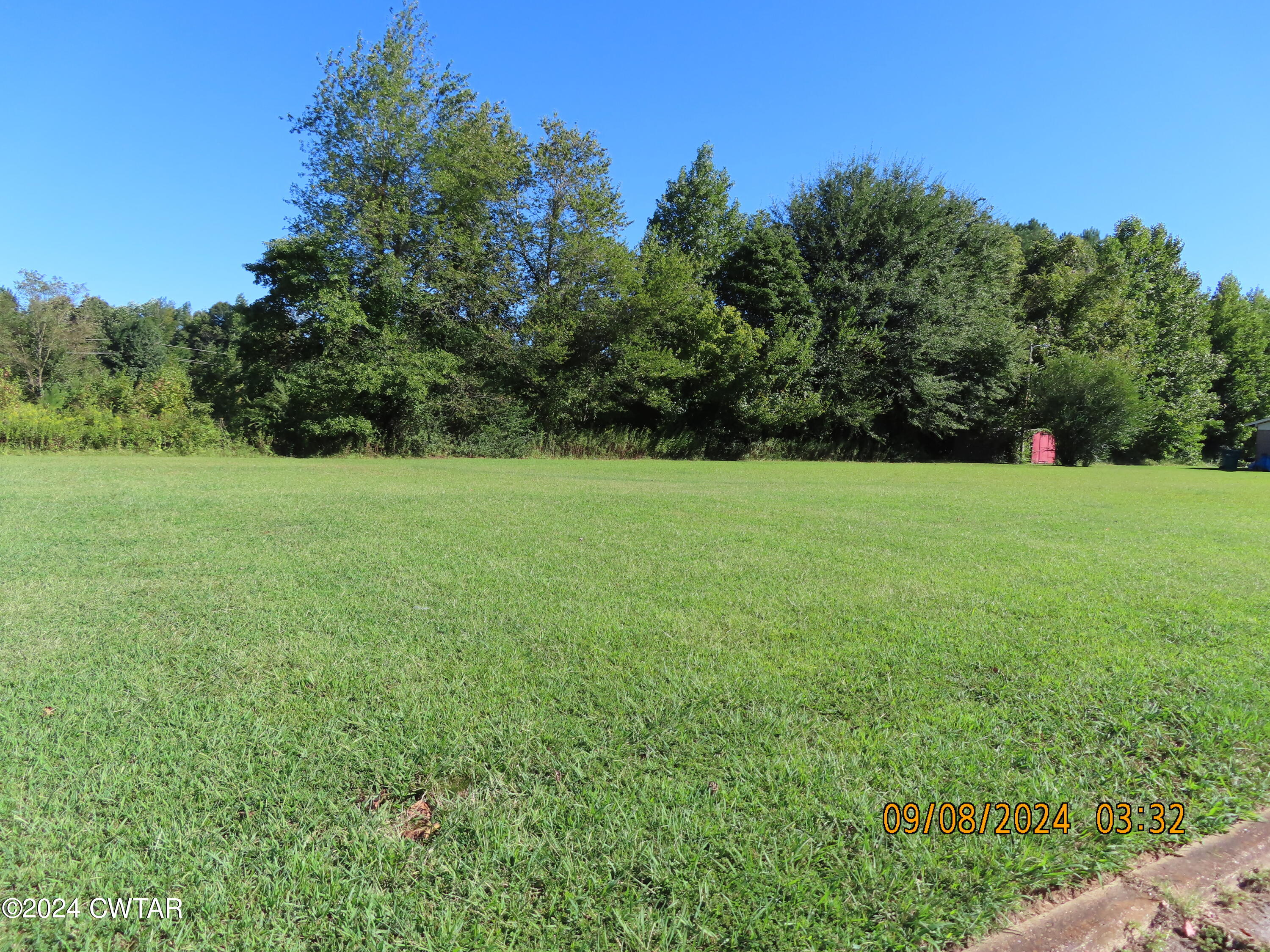 254 Rhea Street Jackson, TN 38301 - Photo 7 of 21 a view of field with trees in the background