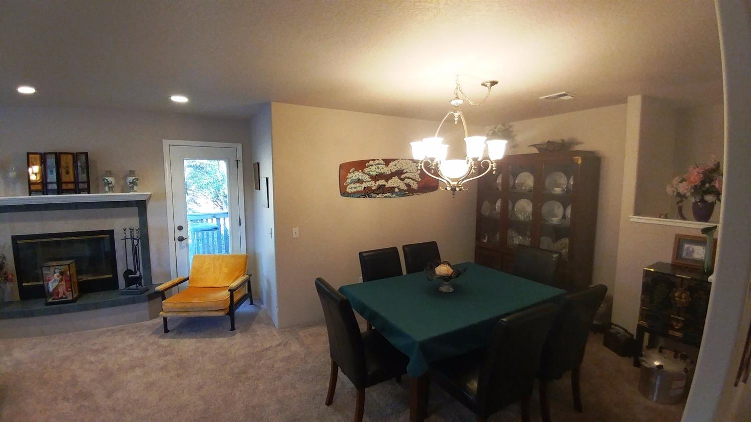 1390 Crow Road Merlin, OR 97532 - Photo 18 of 35 a living room with furniture a dining table and a fireplace