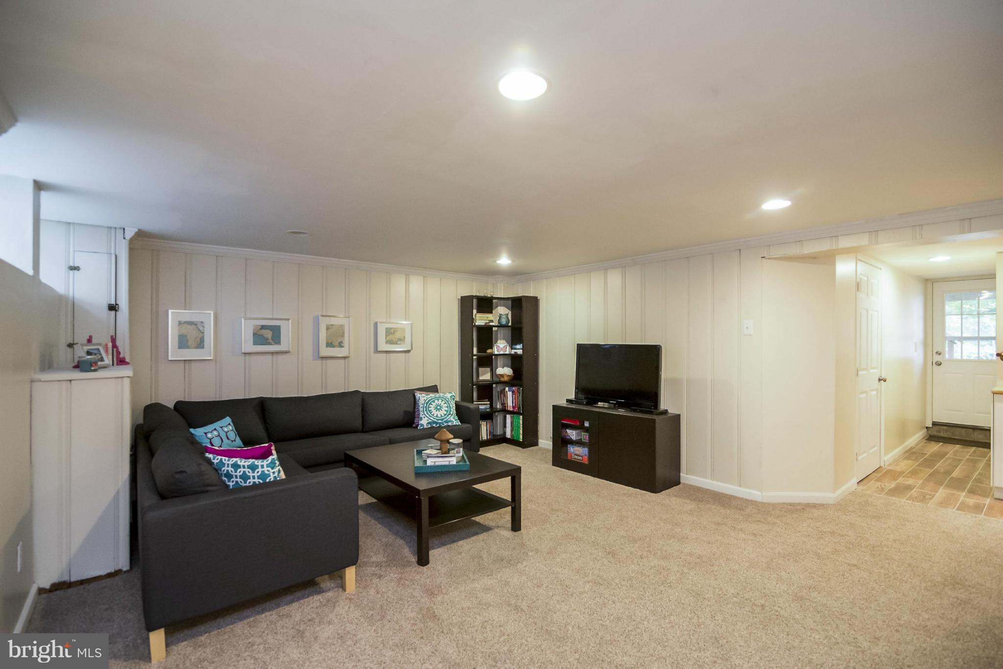 245 Blenheim Road Baltimore, MD 21212 - Photo 11 of 27 a living room with furniture and a flat screen tv