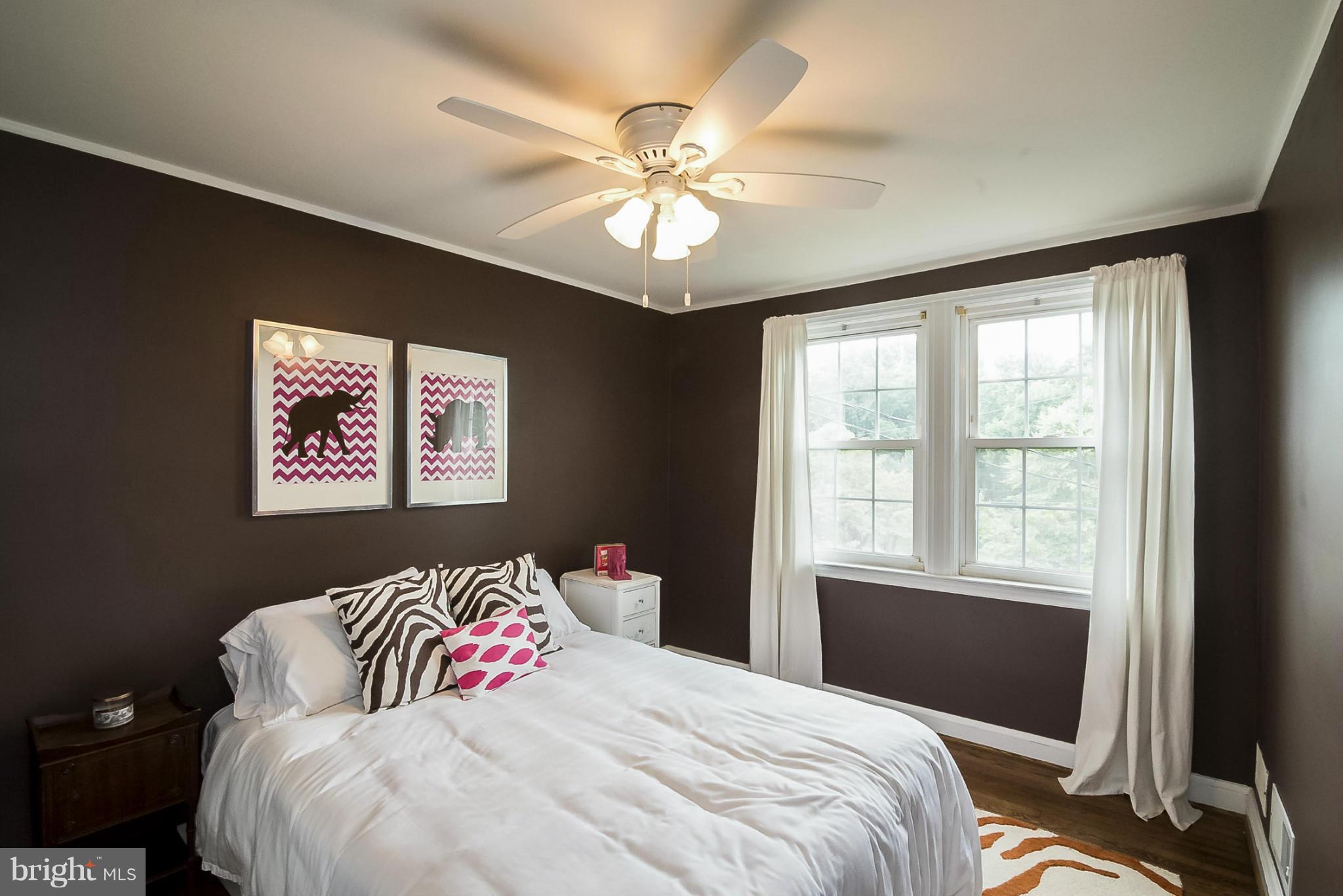 245 Blenheim Road Baltimore, MD 21212 - Photo 17 of 27 a bedroom with a large bed and a window