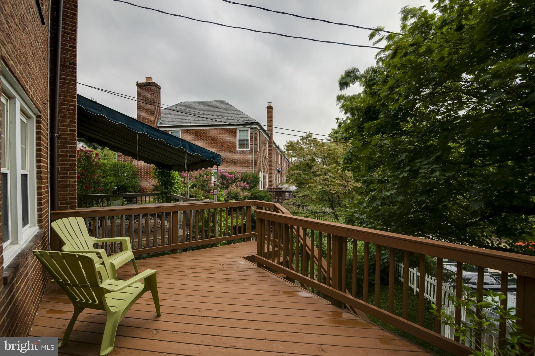 245 Blenheim Road Baltimore, MD 21212 - Photo 20 of 27 a view of a balcony with wooden floor and outdoor seating