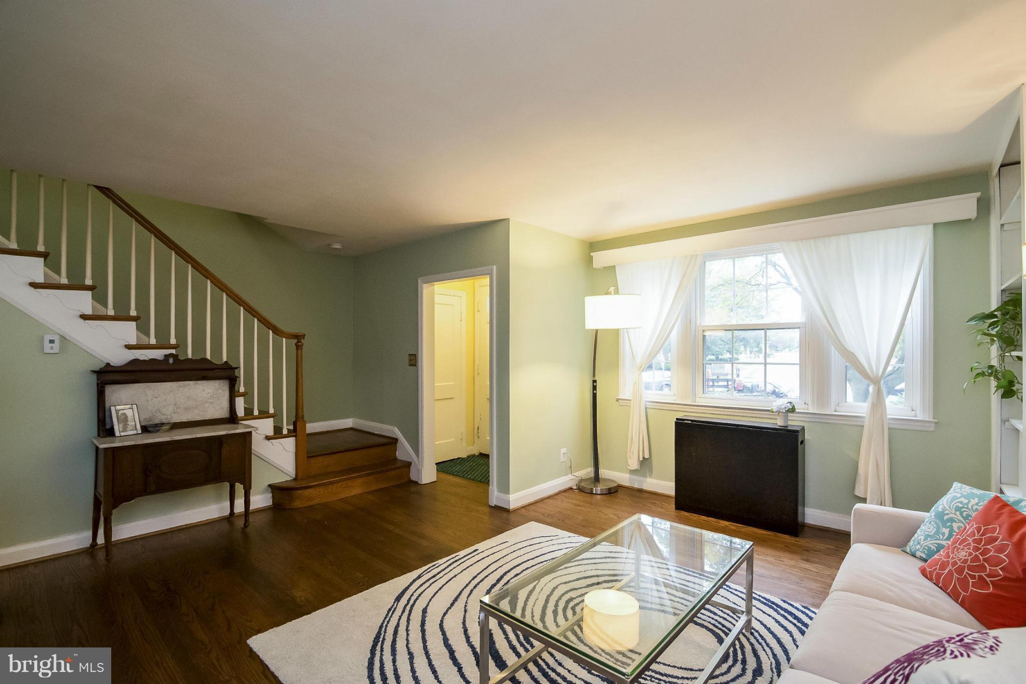 245 Blenheim Road Baltimore, MD 21212 - Photo 3 of 27 a bedroom with furniture and a fireplace