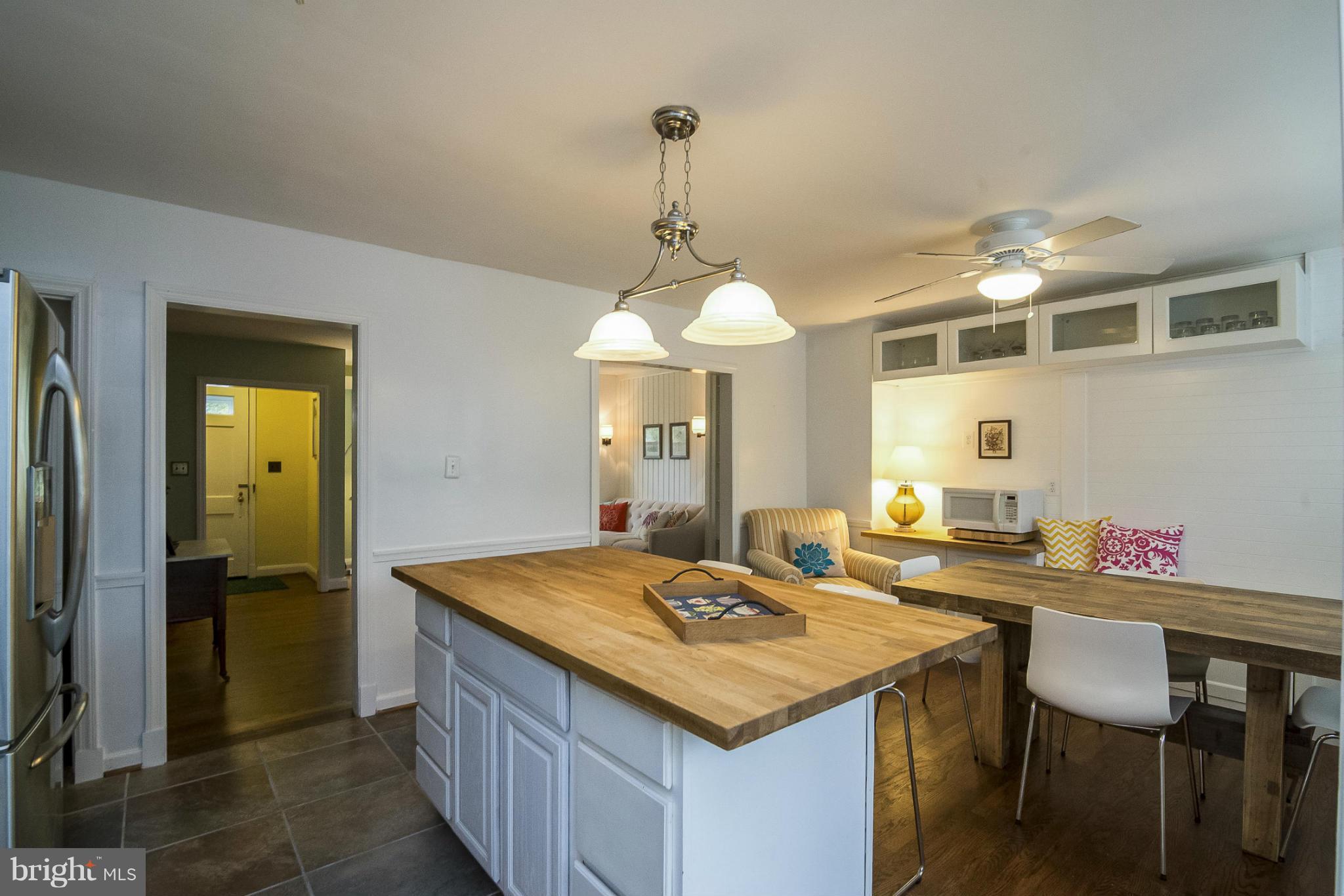 245 Blenheim Road Baltimore, MD 21212 - Photo 9 of 27 a kitchen with a table and chairs in it