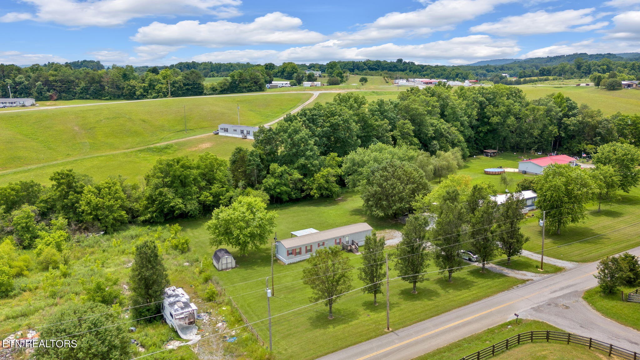 480 Oasis Road Bulls Gap, TN 37711 - Photo 16 of 16 a view of a lake with a yard
