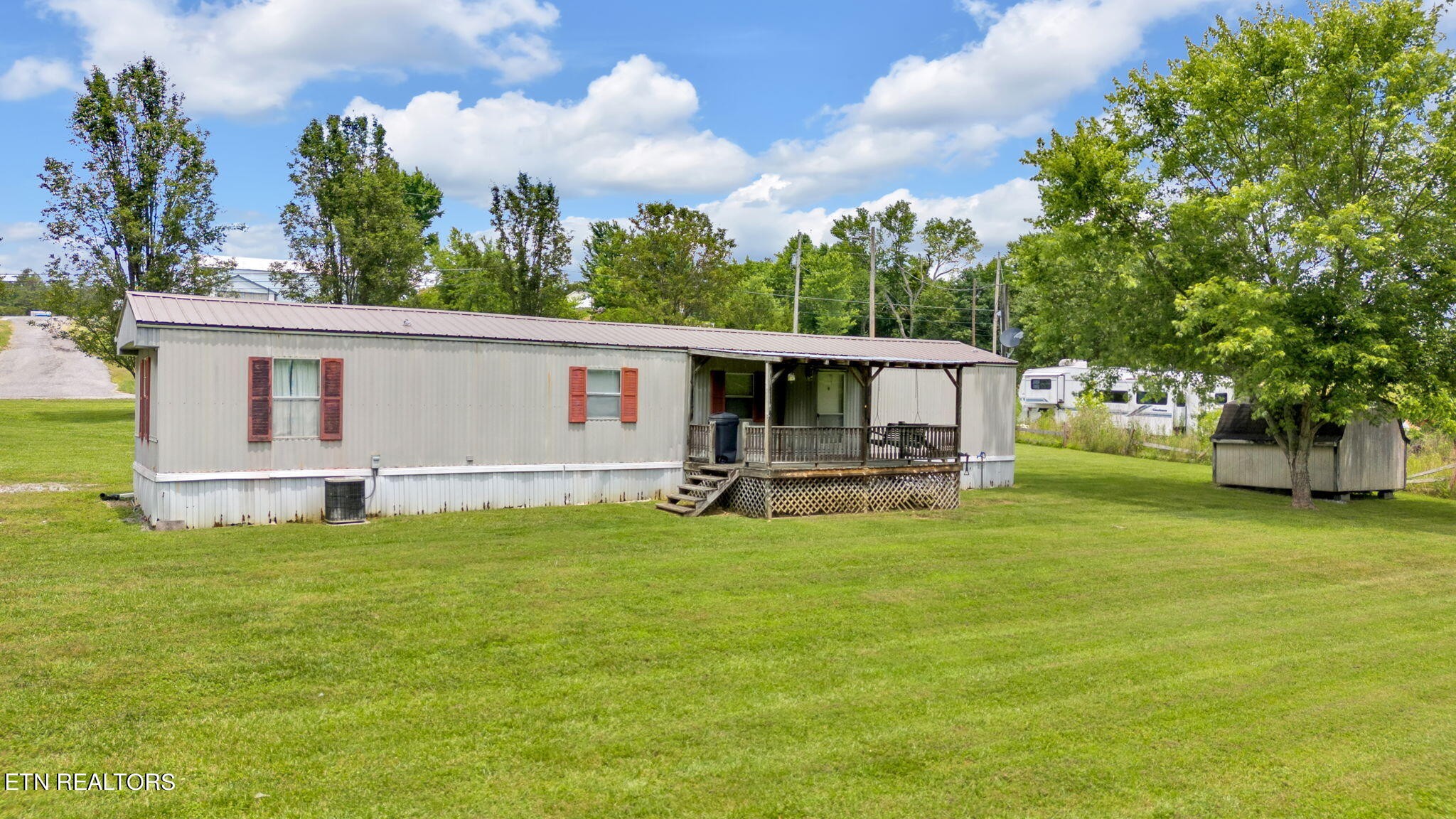 480 Oasis Road Bulls Gap, TN 37711 - Photo 4 of 16 a view of a house with backyard porch and garden