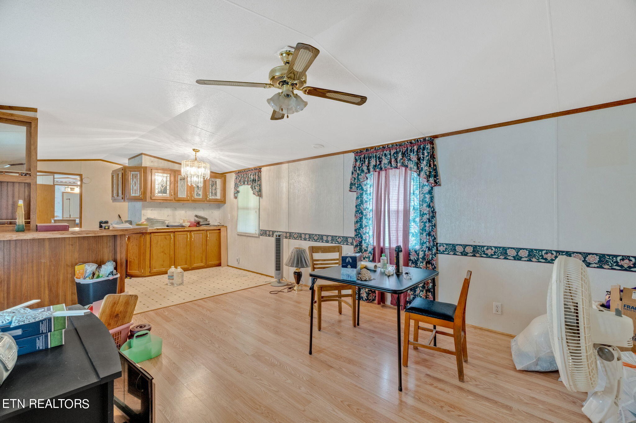 480 Oasis Road Bulls Gap, TN 37711 - Photo 8 of 16 a living room with furniture kitchen view and a wooden floor