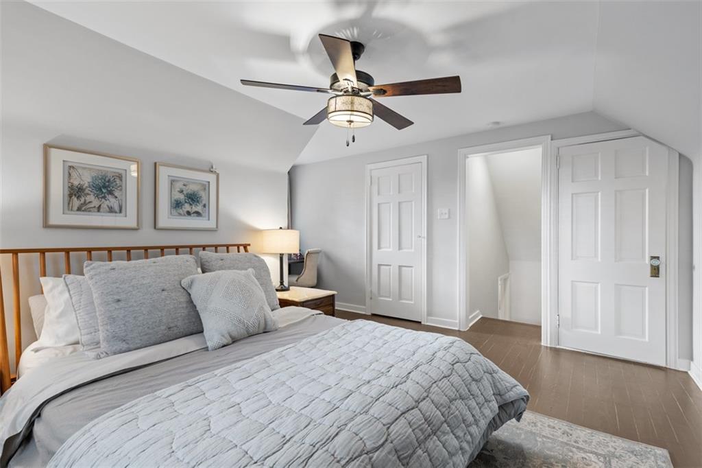 8 Court Place McKees Rocks, PA 15136 - Photo 14 of 32 a bedroom with a large bed and a chandelier