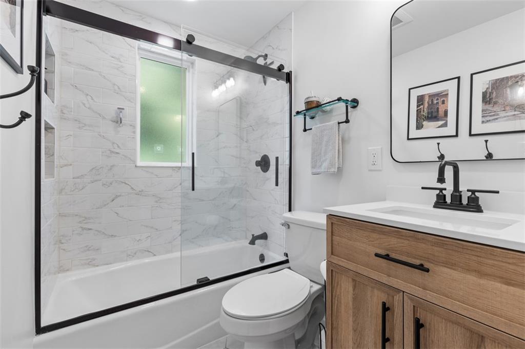 8 Court Place McKees Rocks, PA 15136 - Photo 18 of 32 a bathroom with a granite countertop sink toilet and shower