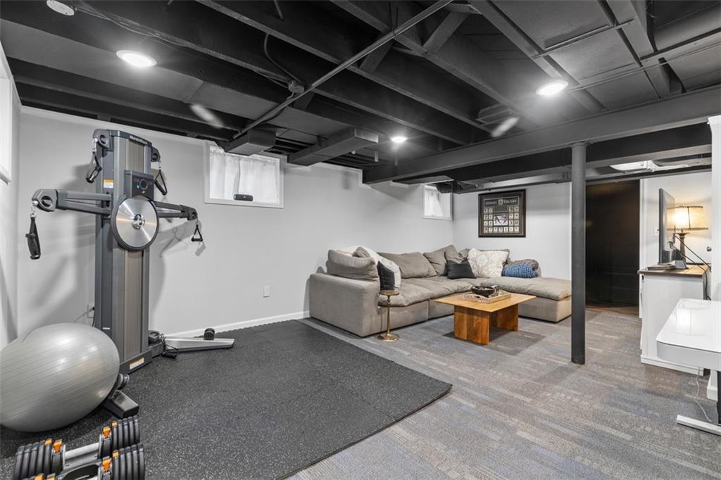 8 Court Place McKees Rocks, PA 15136 - Photo 22 of 32 a living room with furniture and a mirror