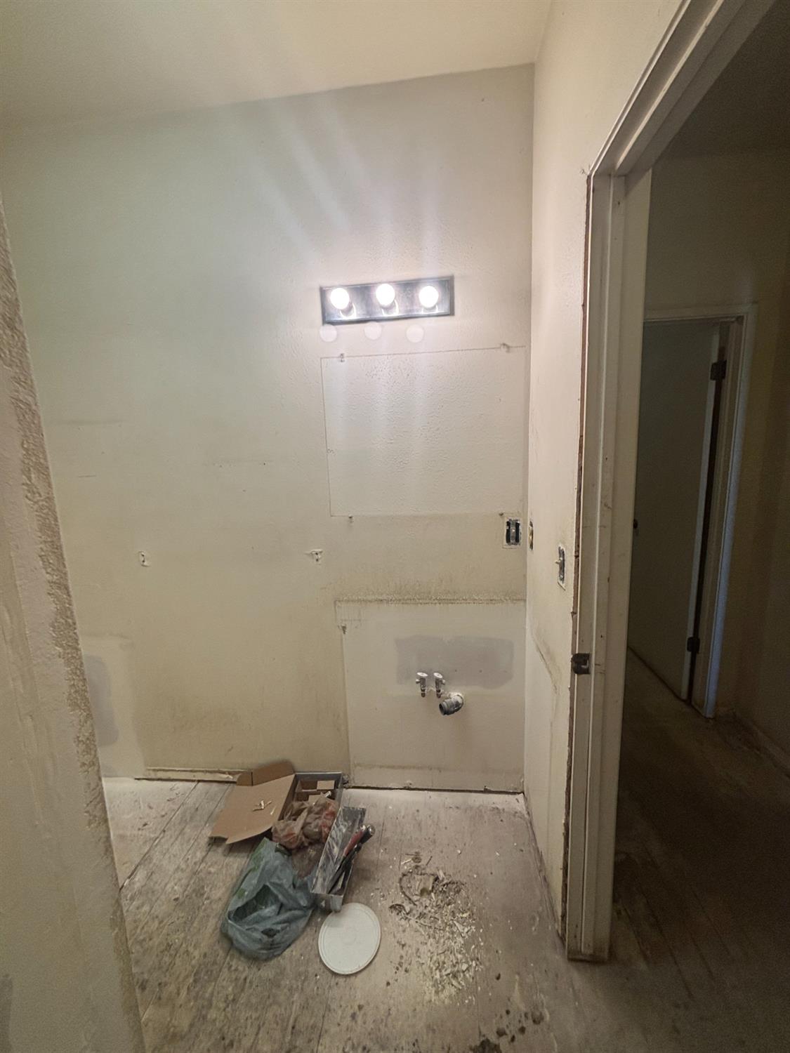 301 East Merced Street Avenal, CA 93204 - Photo 11 of 21 view of a bathroom with a sink and mirror