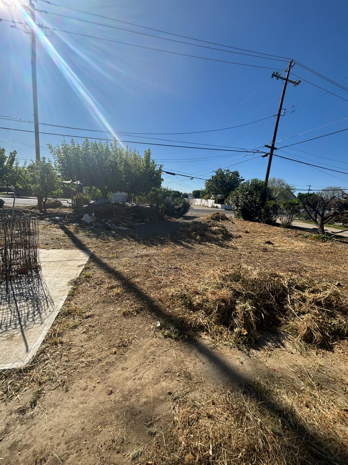 301 East Merced Street Avenal, CA 93204 - Photo 20 of 21 a view of a dry yard with wooden fence