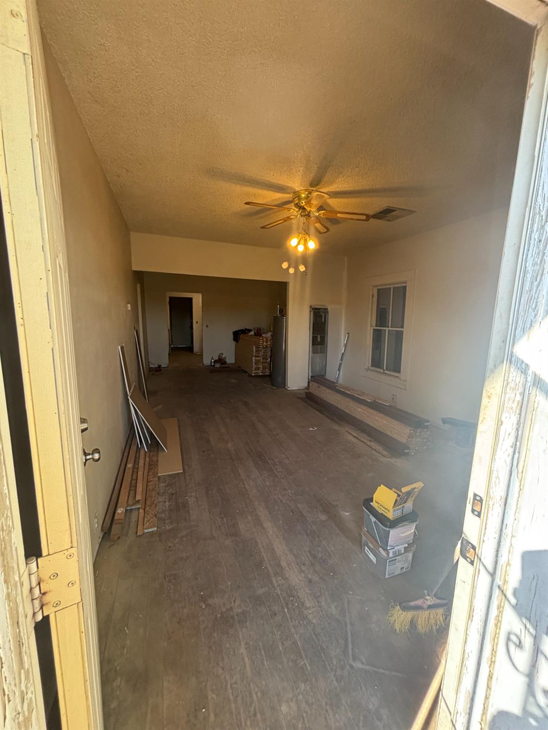 301 East Merced Street Avenal, CA 93204 - Photo 2 of 21 a view of a livingroom with a staircase