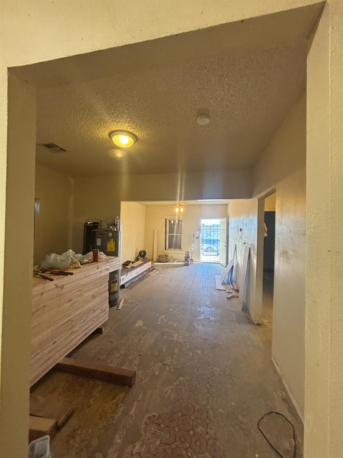 301 East Merced Street Avenal, CA 93204 - Photo 3 of 21 a view of living room filled with furniture and window