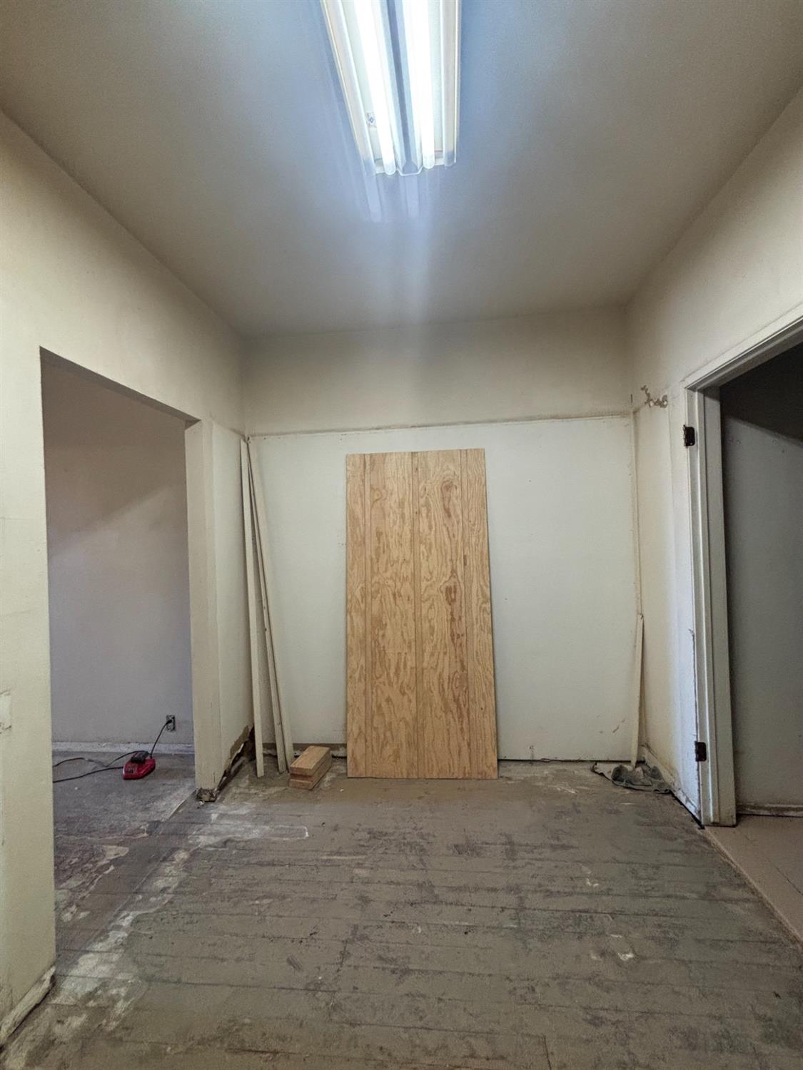 301 East Merced Street Avenal, CA 93204 - Photo 6 of 21 an empty room with windows