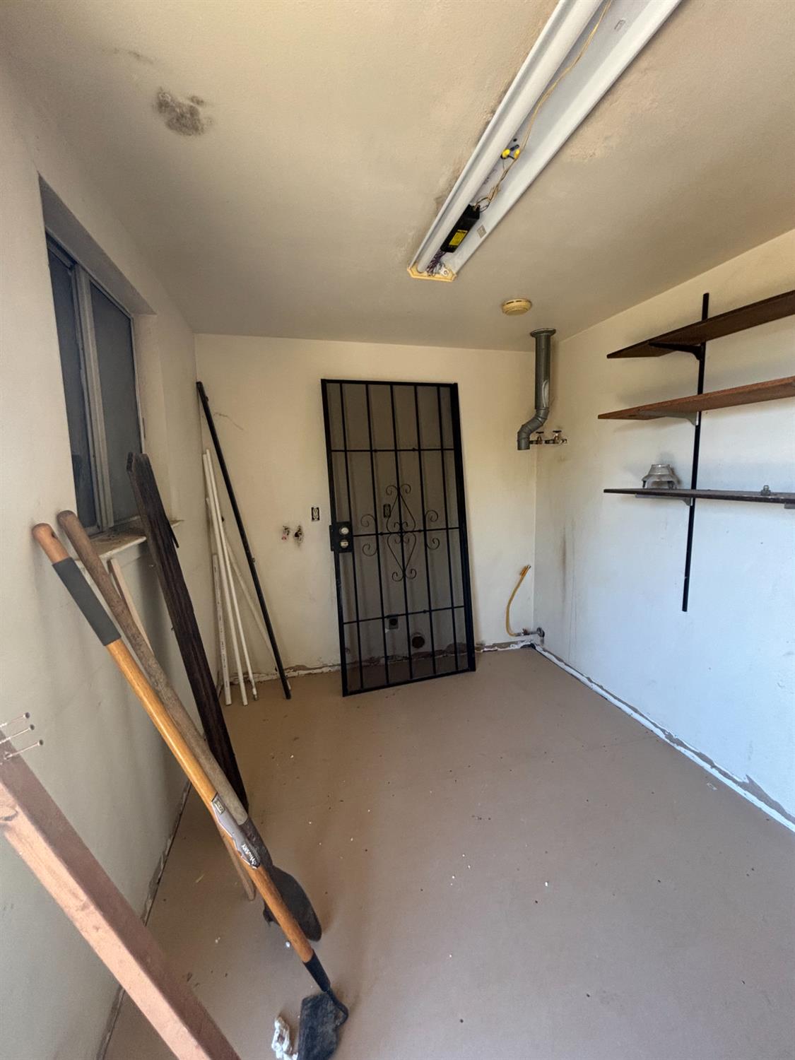 301 East Merced Street Avenal, CA 93204 - Photo 7 of 21 a view of a room with staircase