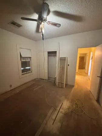 a view of an empty room with a fireplace