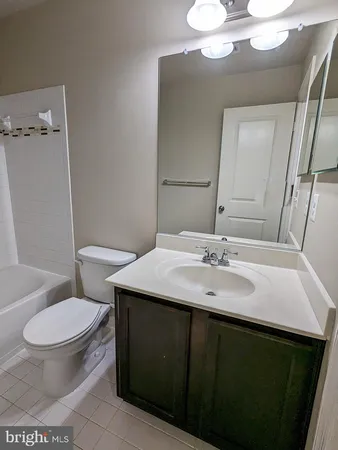 a bathroom with a sink a vanity and a mirror