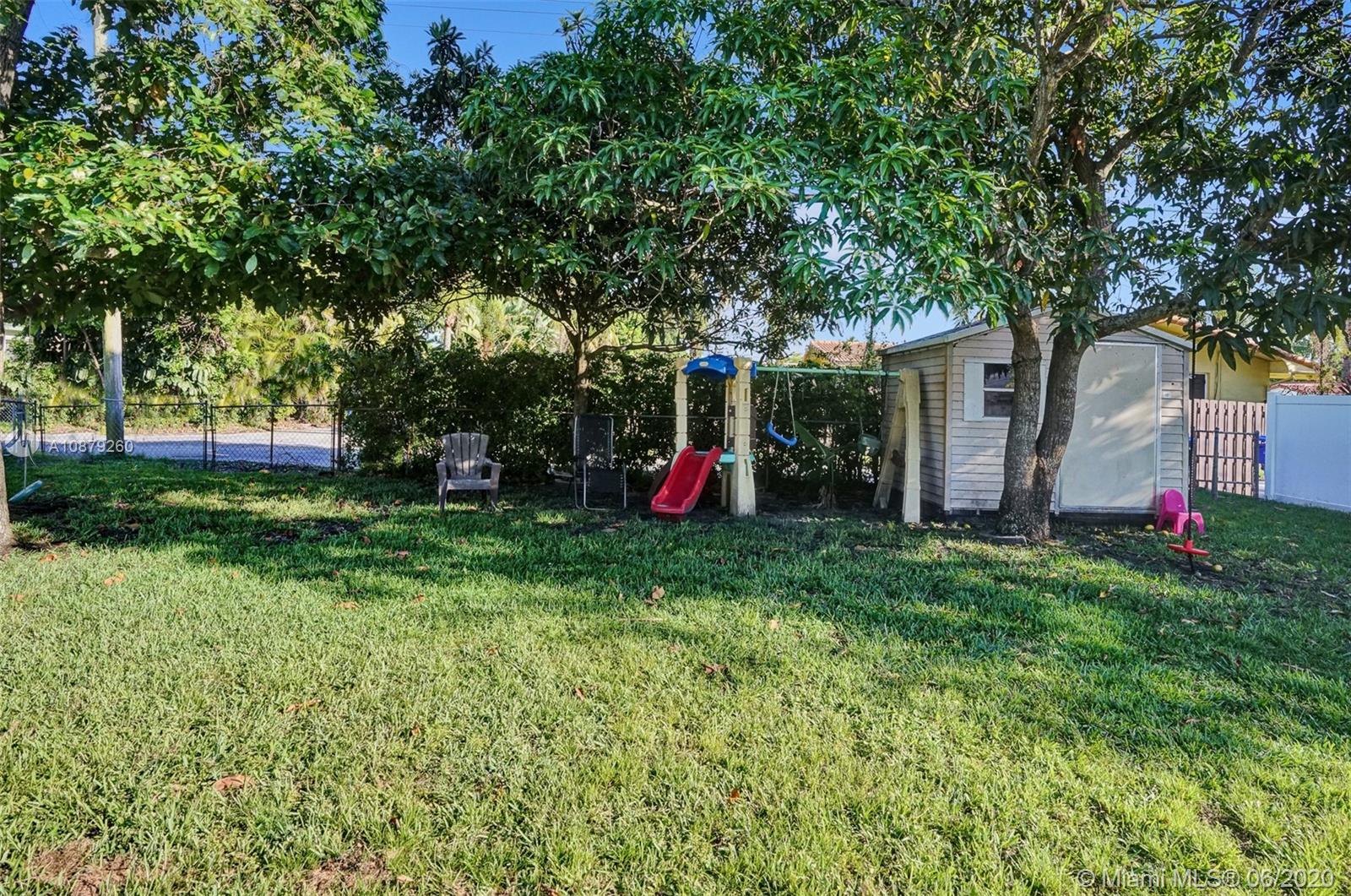 4214 West Park Road Hollywood, FL 33021 - Photo 35 of 38 Mango, avocado, banana, and loquat trees + shed for additional storage space!!!