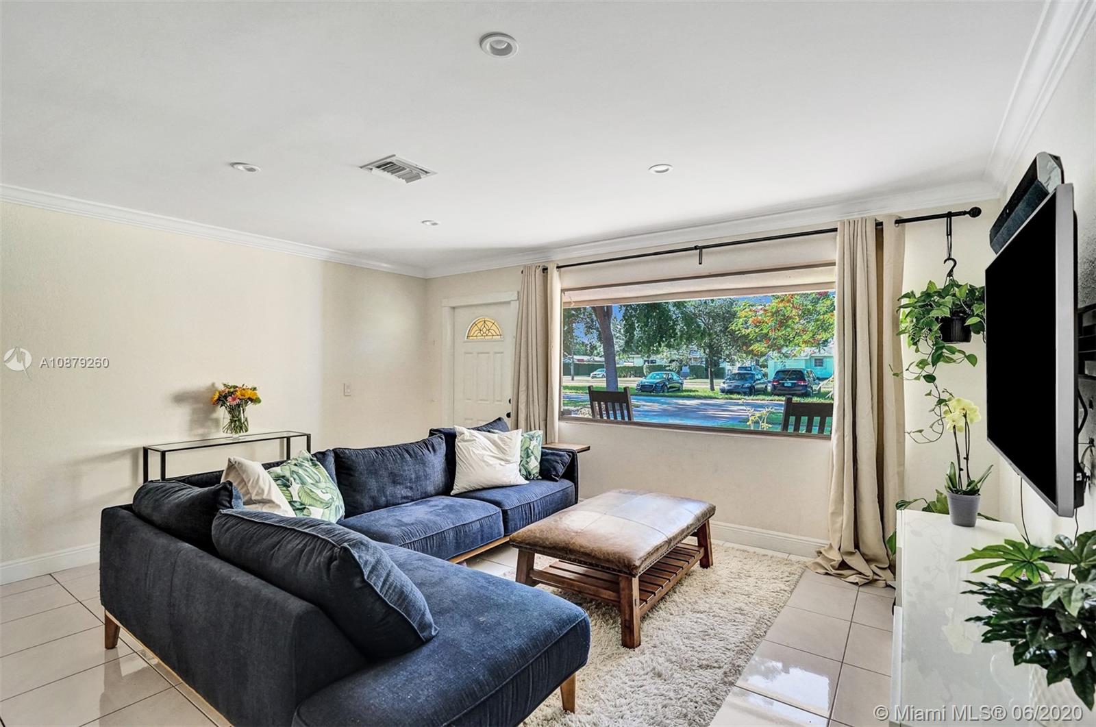 4214 West Park Road Hollywood, FL 33021 - Photo 6 of 38 Big picture window in living room letting in tons of natural light.