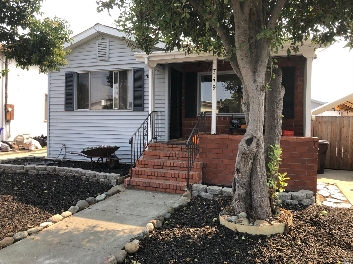 749 First Street Rodeo, CA 94572 - Photo 1 of 1 a view of a house with backyard and sitting area